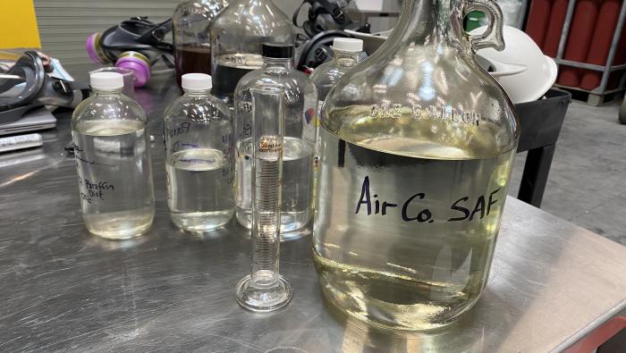 a jug of experimental sustainable aviation fuel