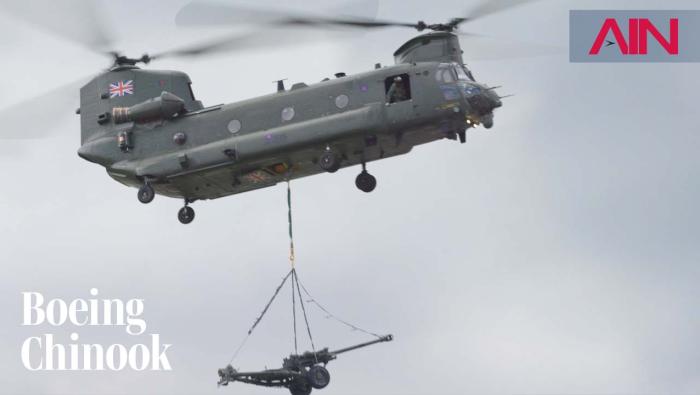 Boeing CH-47 Chinook helicopter flying with underslung gun