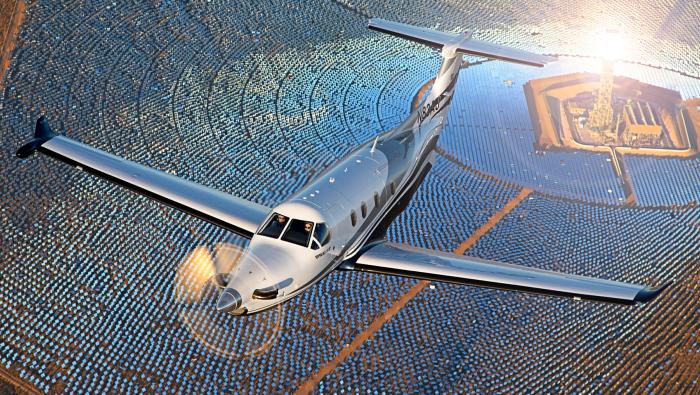 Artist rendering of PC-12 Flying over Solar SAF facility