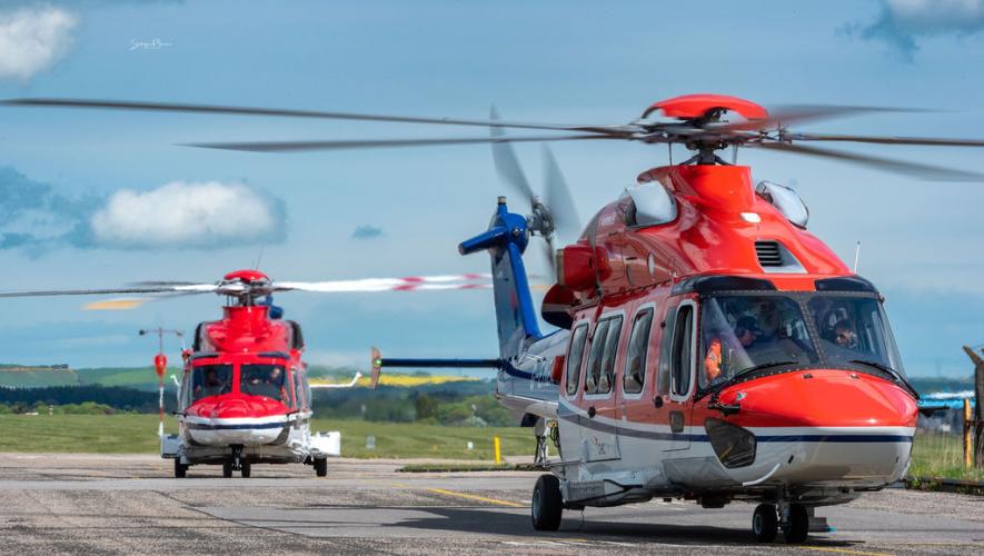 CHC H175 helicopters on airport ramp