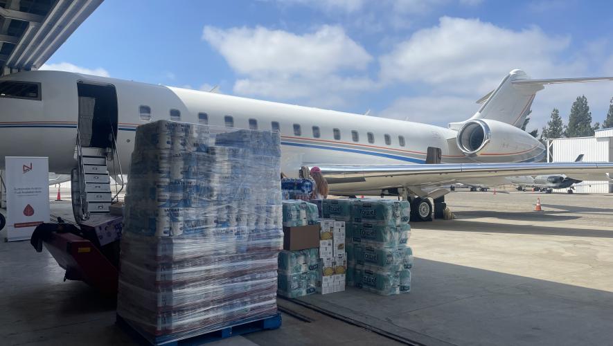 Business jet being loaded with relief supplies