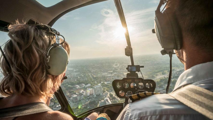 man and woman in helicopter