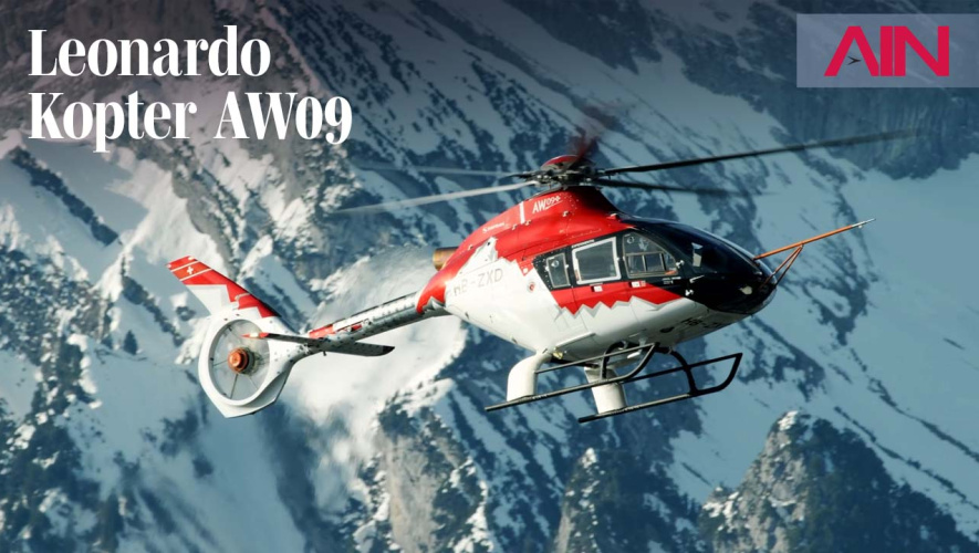 Kopter AW09 helicopter flying near mountains