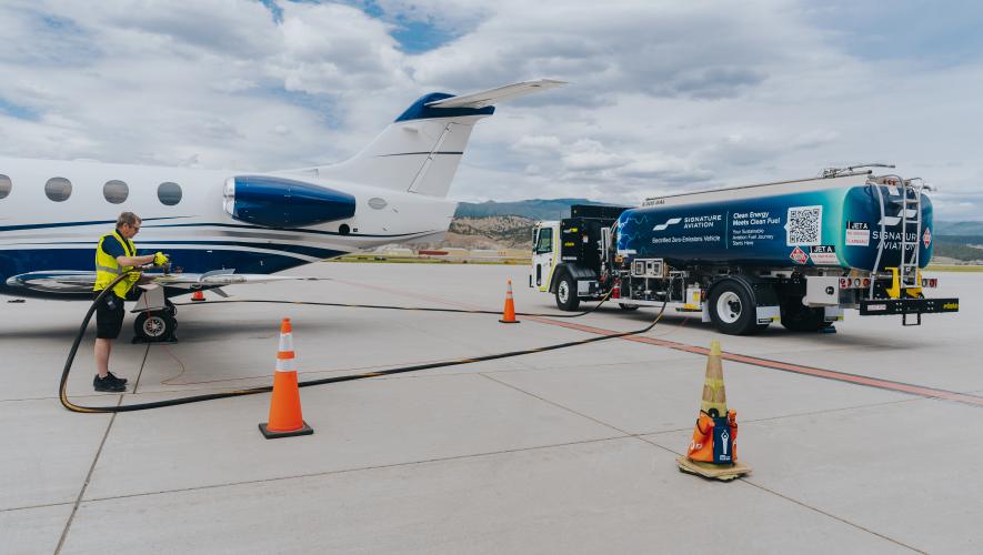 Signature line service technician refueling airplane with SAF