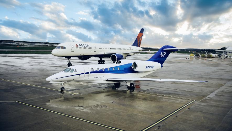 Delta Air Lines aircraft with a Wheels Up Citation business jet