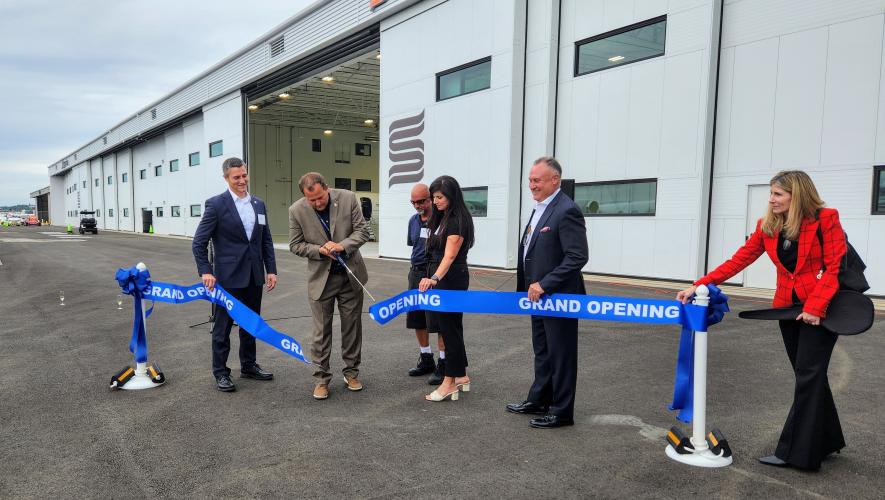 Boeing Field officials and Skyservice executives hold a ribbon-cutting ceremony at the new Skyservice Seattle FBO