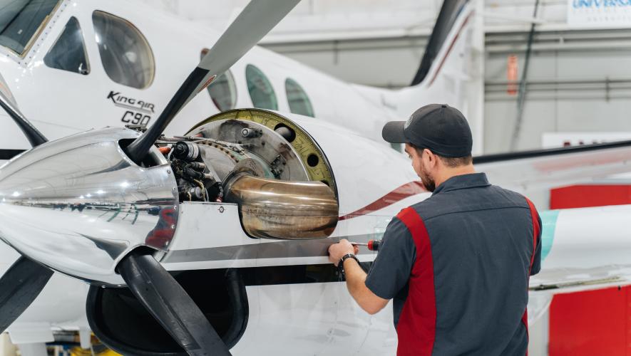 Stevens Aerospace technician working on airplane