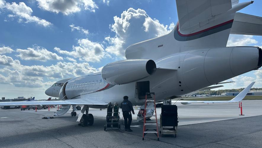 business jet on ramp receiving maintenance