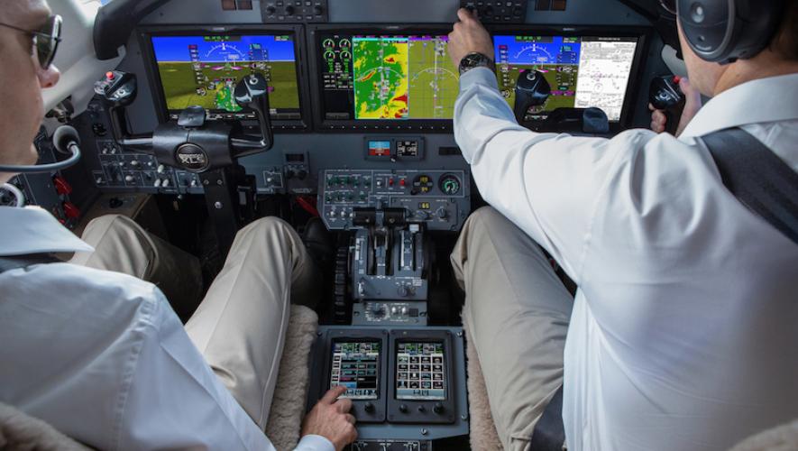 Pilots in Garmin G5000 equipped flight deck 