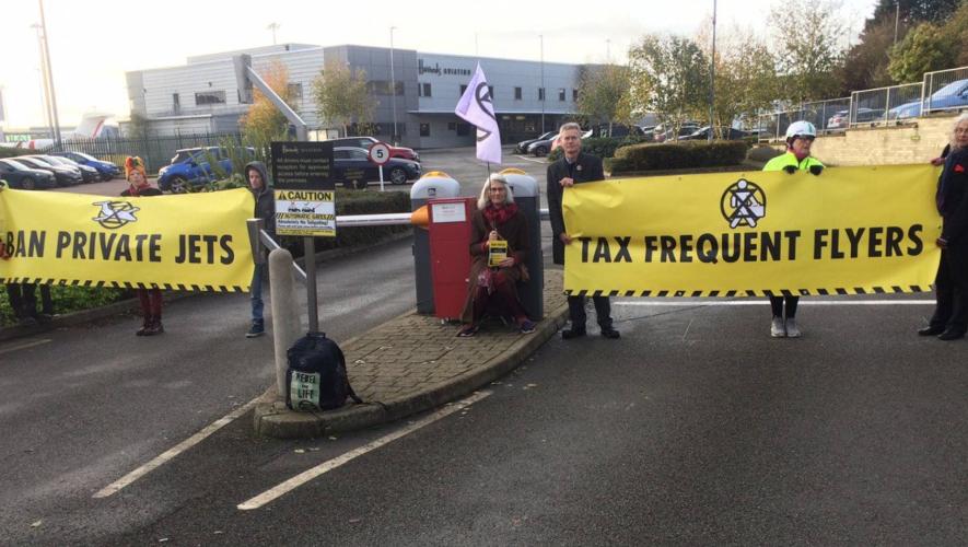 Environmental protesters outside the business aviation area of London Luton Airport.