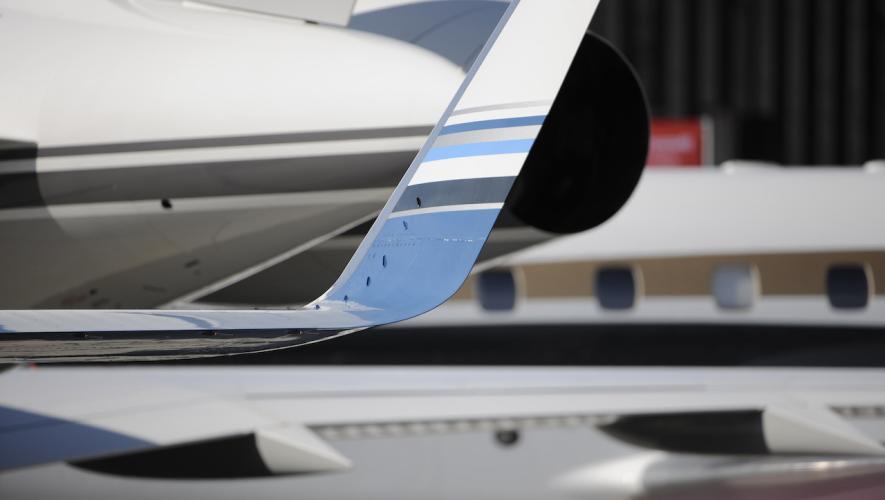 abstract view of parts of business jets on airport ramp