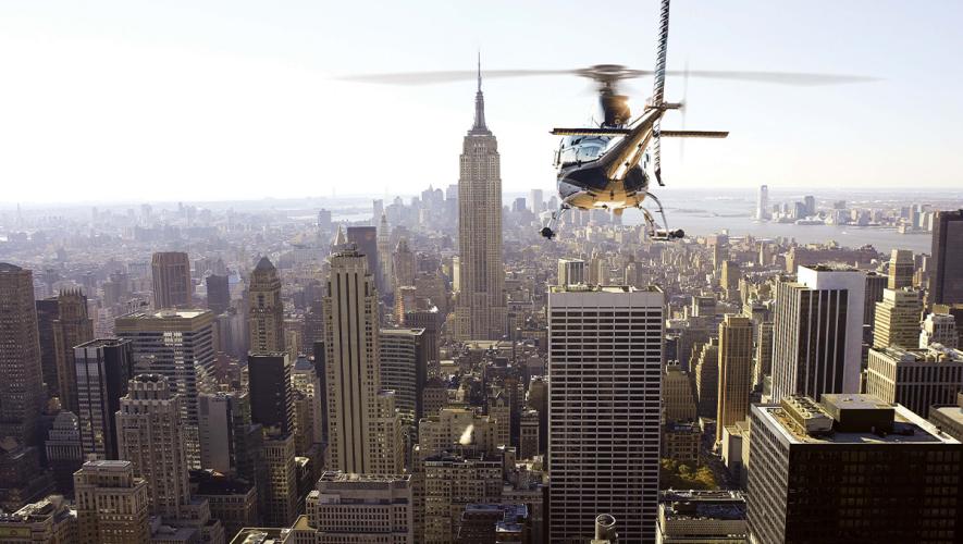 Wings Air Airbus AS350 helicopter in flight over New York City