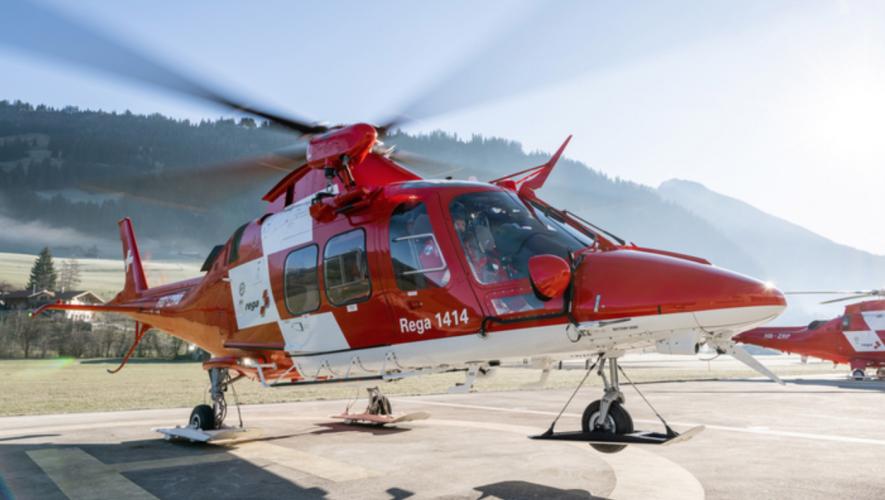 Swiss Air Rescue Rega air ambulance helicopter lifts off from helipad
