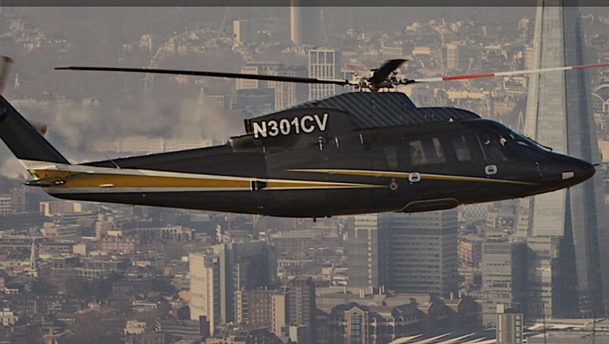 Flexjet Sikorsky S-76 helicopter in flight over European city