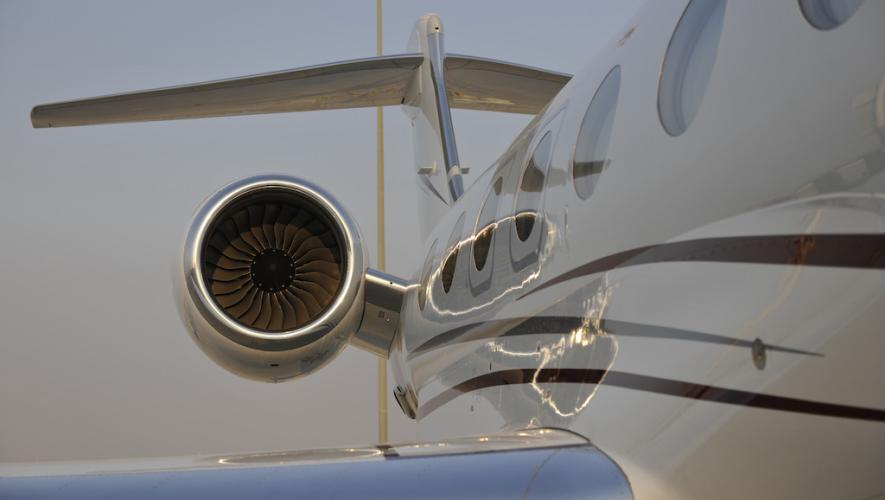 Side view of business jet looking toward engine and tail