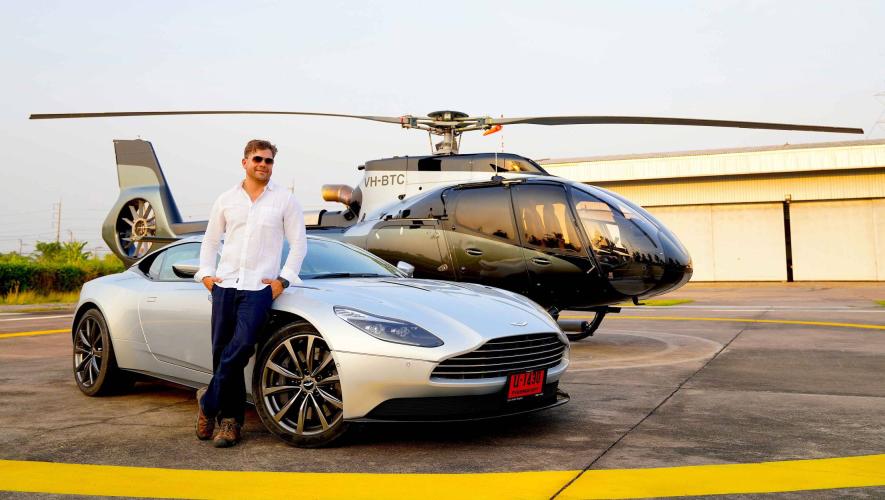 Pilot John-Paul Thorbjornsen with ACH130 Aston Martin Edition helicopter and sports car