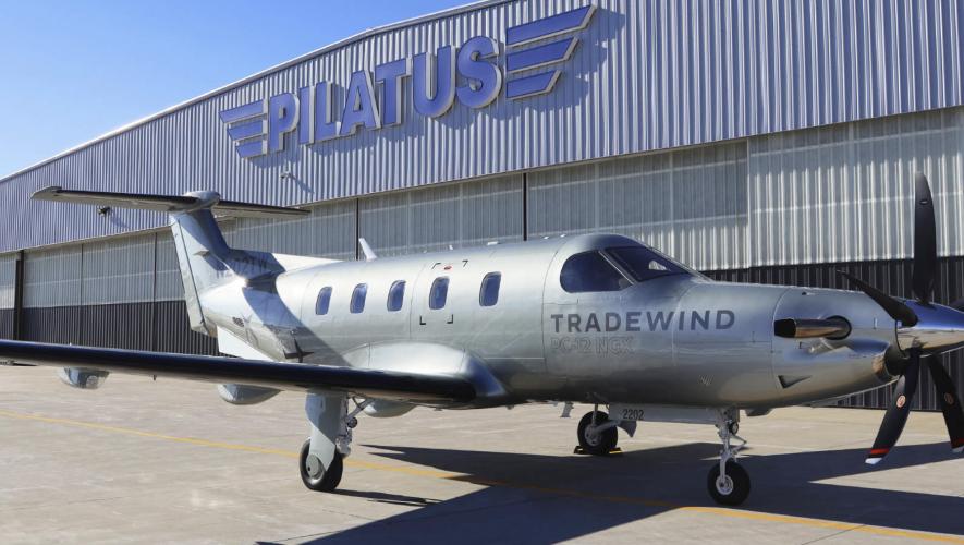 Tradewind branded Pilatus PC-12NGS on airport ramp outside of Pilatus hangar
