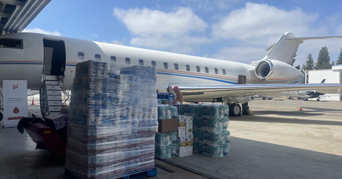 Business jet being loaded with relief supplies