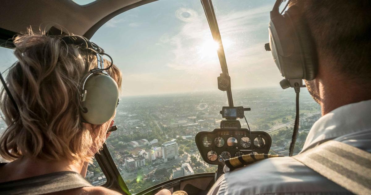 man and woman in helicopter