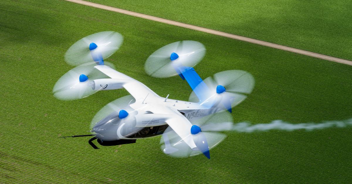 Joby's eVTOL aircraft with blue livery and trail of water vapor behind it