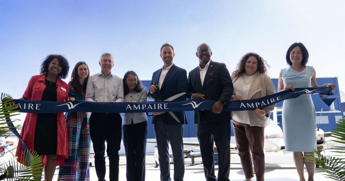 Ampaire CEO Kevin Noertker cuts the ribbon outside the company's new Long Beach headquarters during the grand opening ceremony on Aug. 27, 2024.