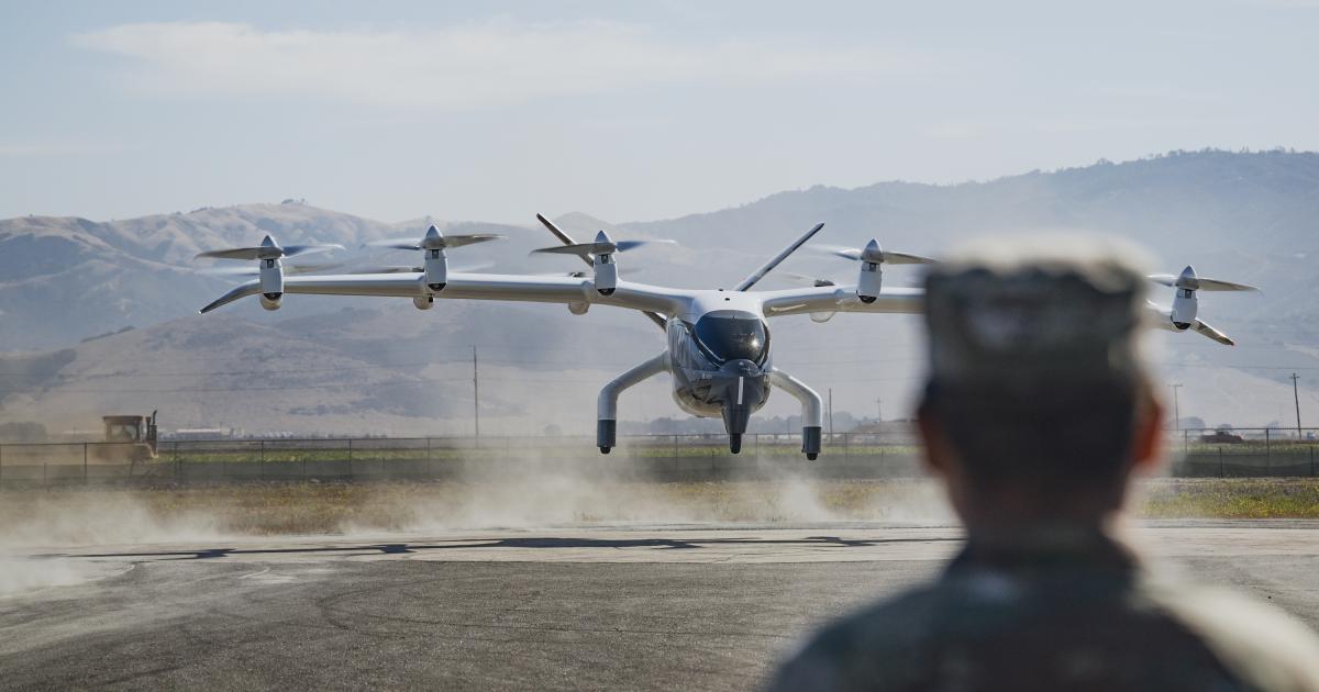 A member of the USAF views Midnight during a test flight