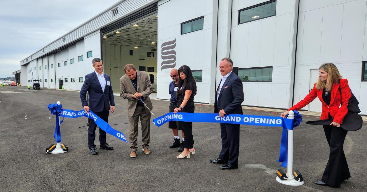 Boeing Field officials and Skyservice executives hold a ribbon-cutting ceremony at the new Skyservice Seattle FBO