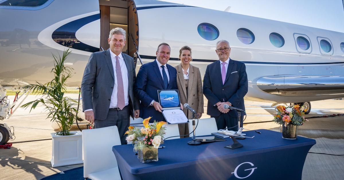 Gulfstream and DC Aviation executives sign a contract for a new G400 aircraft