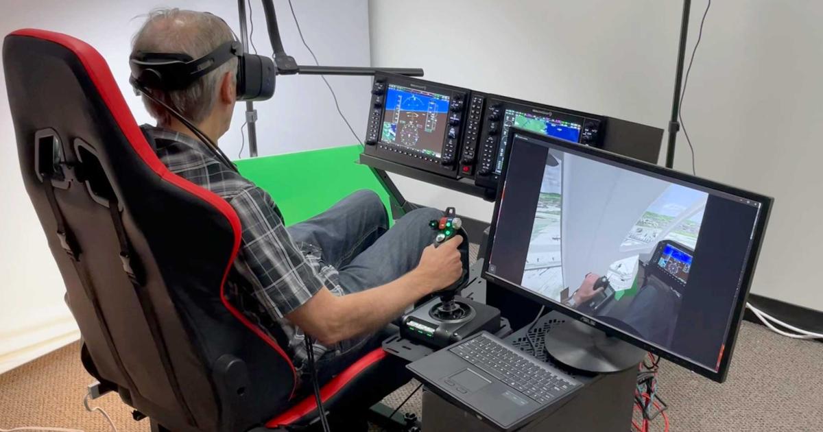A person wearing a VR headset uses Quantum3D's Limosa simulator
