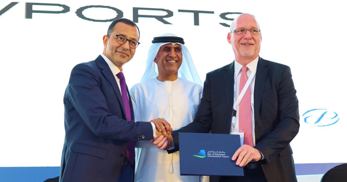 VPorts president and founder Fethi Chebil; His Highness Eng. Salem bin Sultan Al Qasimi, chairman of the Department of Civil Aviation in Ras Al-Khaimah; and Ralf Schustereder, CEO of Ras Al-Khaimah Airport, shake hands at the Arab Aviation Summit on March 8, 2023.