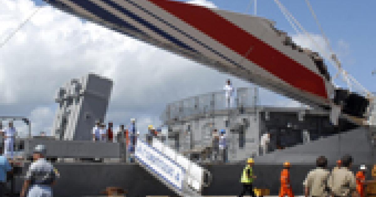 Debris from the missing Air France A330-200 recovered from the Atlantic Ocean arrives at the port of Recife, Brazil on June 14, 2009.