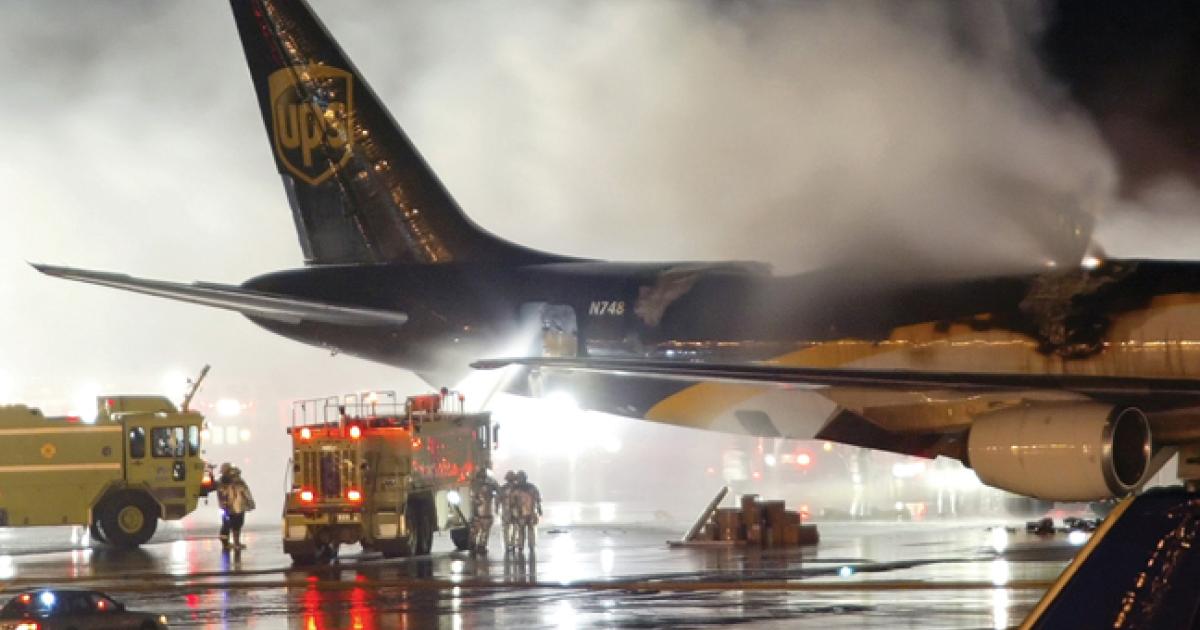 Firefighters douse a blaze on board a UPS DC-8 at Philadelphia International. Lithium-ion batteries were initially considered a source of the fire, but the NTSB later determined they were not the source of ignition.