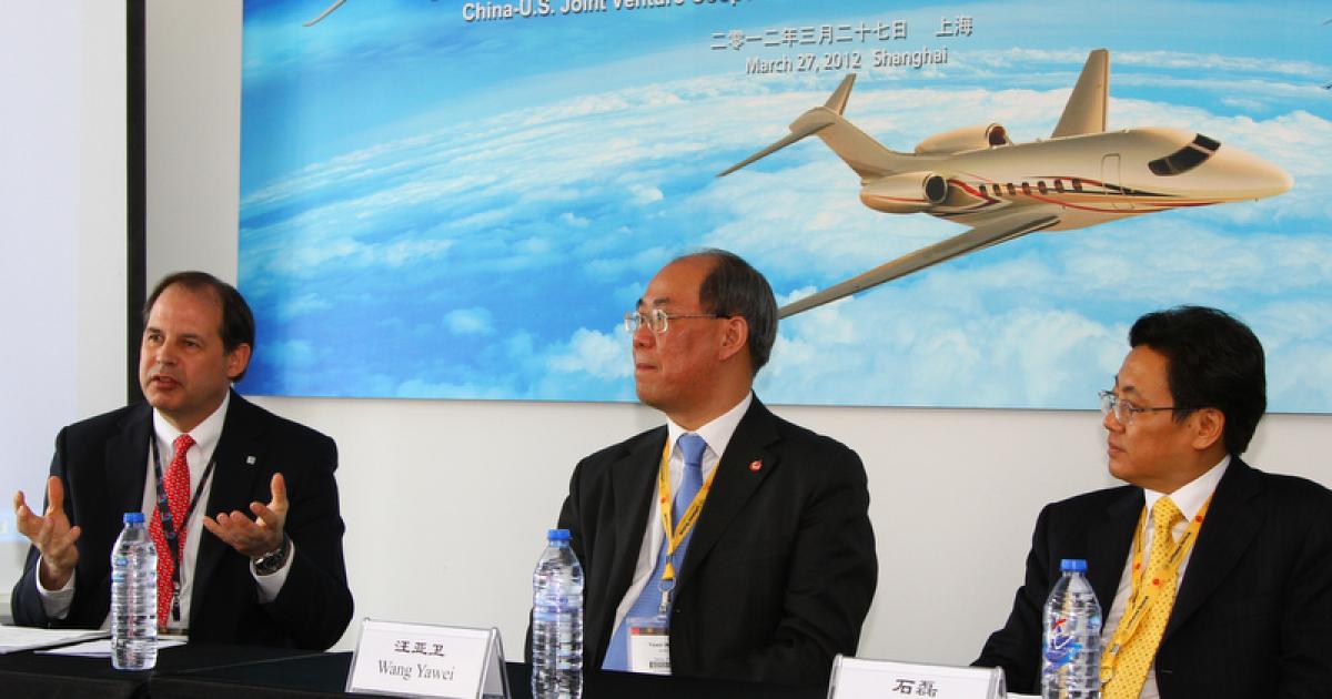 Scott Ernest, president and CEO of Cessna Aircraft, Wang Yawei, president of Avic Aviation Techniques, and and Shi Lei, head of the Chengdu investment promotion commission.