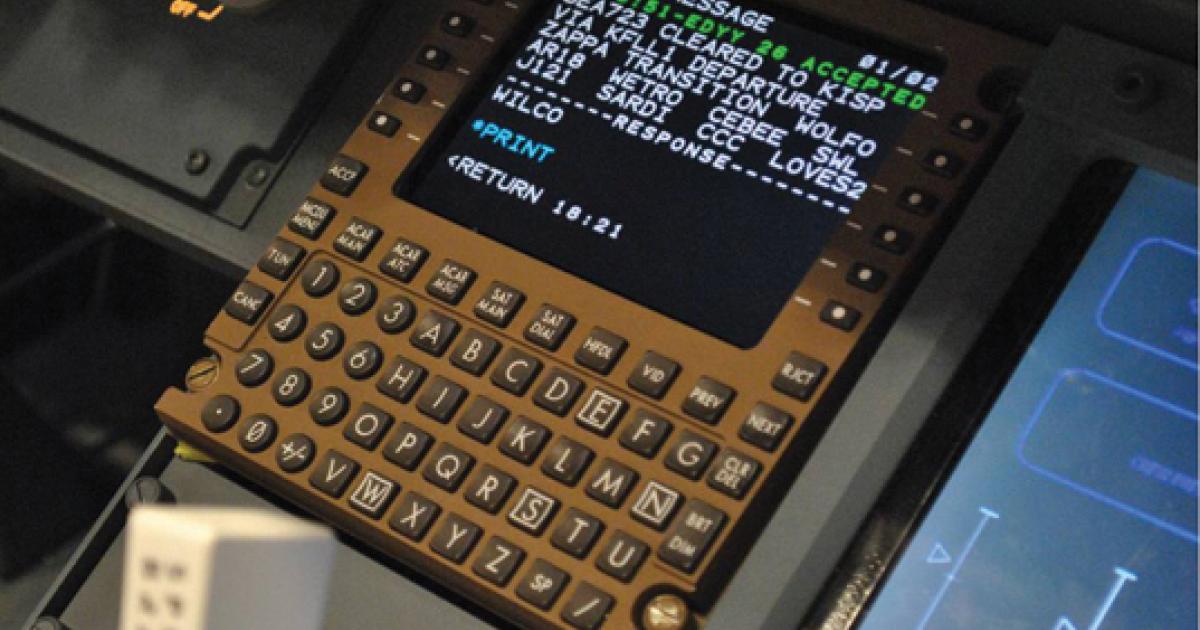 A multifunction control display unit in aircraft cockpit shows a controller-pilot datalink communications (CPDLC) message. (Photo: FAA)