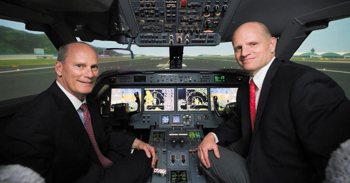 Gulfstream president Larry Flynn (left) and FlightSafety executive v-p Eric Hinson at the grand opening of the two companies’ new Hong Kong training center. 