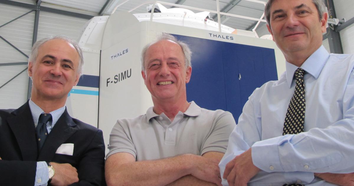 From left to right: Pedro Silveira, United Helicopter Services group chairman; Louis Agnel, SAF chief pilot and head of training center; and Christophe Rosset, SAF president, in front of SAF’s new EC135 flight simulator.