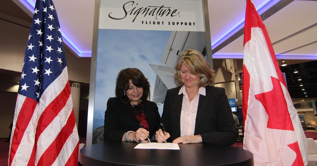 Maria Sastre, President and COO Signature Flight Support signed an agreement with Marilyn Boston, Aviation Manager of Imperial Oil.