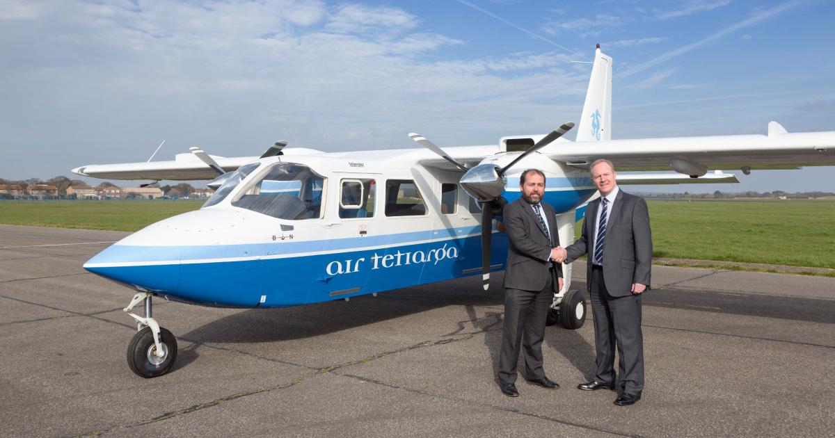 William Hynett, left, Britten-Norman Group CEO, and Stuart McNeilis, head of sales and customer relations for Marshall Aviation Services, mark a year-long agreement for Marshall to paint up to 15 Islanders and Defenders.