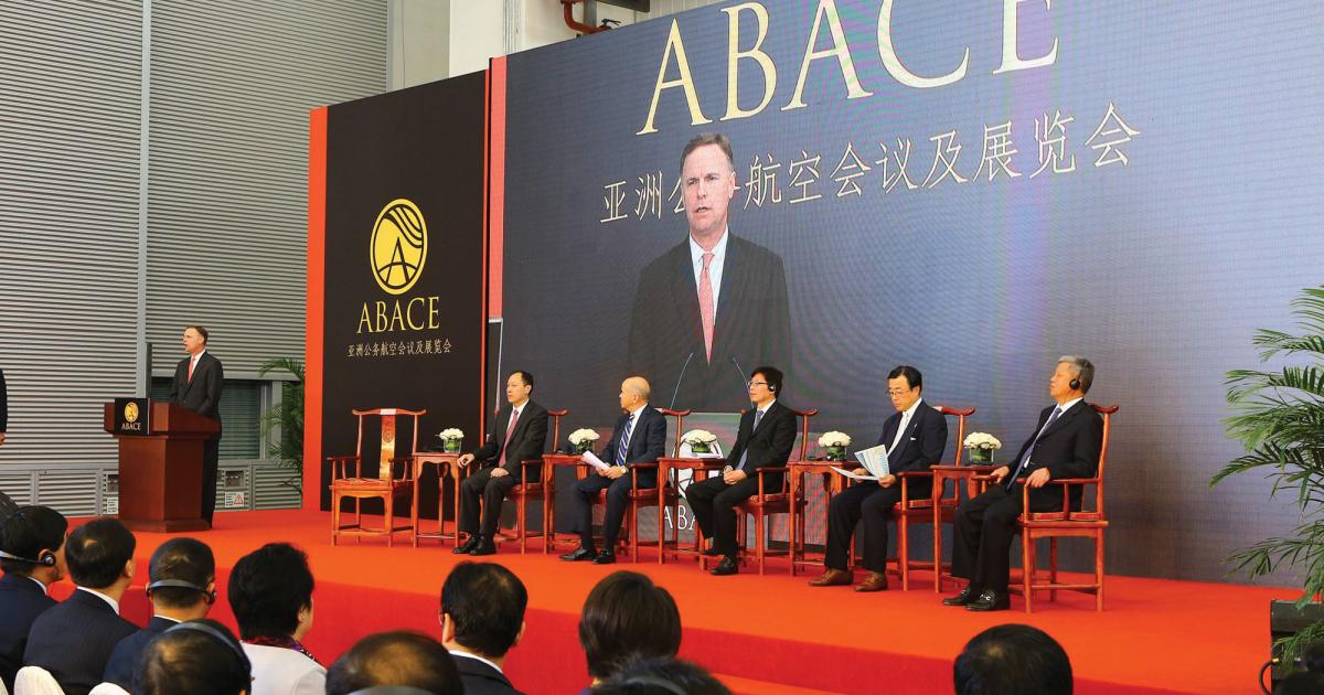 NBAA president and CEO Ed Bolen (at lectern) addresses the opening session of this year’s ABACE show. Sharing the stage were (left to right) Jiang HuaiYu, director of the Civil Aviation Administration of China (CAAC) central and southern regions; Michael Huerta, administrator, U.S. Federal Aviation Administration; Wang Zhiqing, deputy administrator CAAC; Masaaki Kai, senior deputy director general of the Japan Civil Aviation Bureau; and Li Derun, president of the Shanghai Airport Authority (SAA). Not pictured, master of cermonies Jing Yiming, vice-president SAA. 