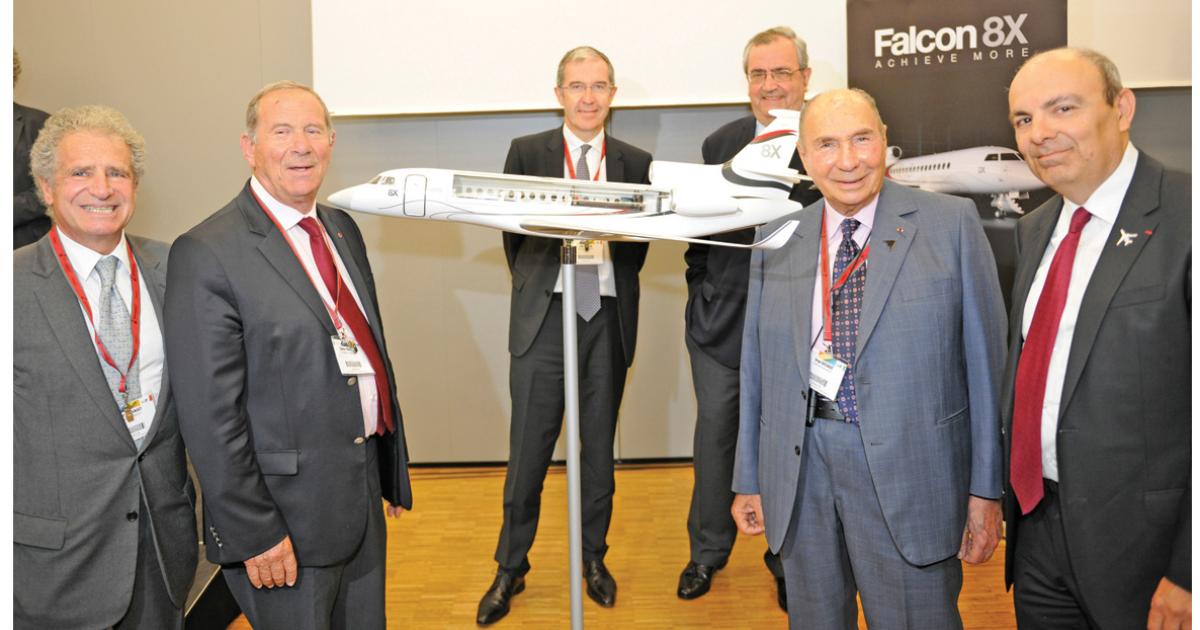 Dassault executives celebrate the launch of their newest model, the Falcon 8X. Left to right: Laurent Dassault, vice chairman and CEO of Groupe Industriel Marcel Dassault; Charles Edelstenne, retired chairman and CEO of Dassault Aviation; Loïk Segalen, COO Dassault Aviation; John Rosanvallon, president and CEO of Dassault Falcon Jet; launch customer Serge Dassault, chairman and CEO Groupe Dassault; and Eric Trappier, Chairman and CEO, Dassault Aviation. (Photo: Mark Wagner)