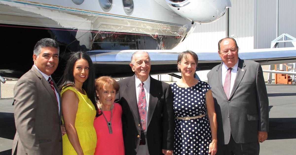 Left to right: Rep. Tony Cardenas, LA councilwoman Nury Martinez, Si and Betty Robin, principal Carlynn Huddleston and Clay Lacy attended the handover of the Clay Lacy jets to the North Valley Occupational Center-Aviation.