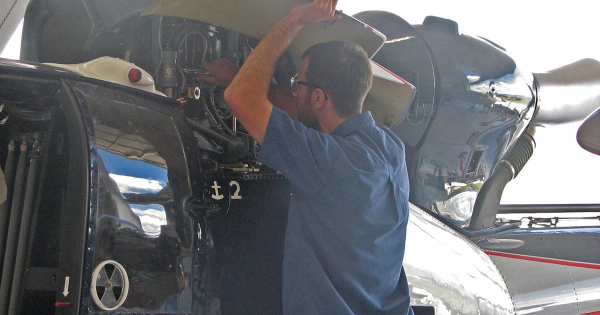 A Trine Aerospace & Defense mechanic performs a post-flight engine inspection of an Airbus Helicopters SA341F2 Gazelle at the company’s 30,000-sq-ft commercial modification facility at Colorado Springs Airport.