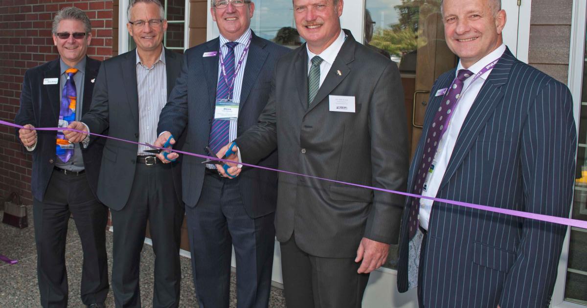 Left to right: Bruce Banman (Mayor of Abbotsford), Ed Fast (Member of Parliament, Abbotsford), Steve Fitz-Gerald (Marshall Aerospace and Defence Group CEO), Michael de Jong (British Columbia Minister of Finance and Member of the Legislative Assembly, Abbotsford West) and Charles Hughes (vice president of strategy and business development, Marshall ADG) cut the ribbon at the company's Canadian head office and base.