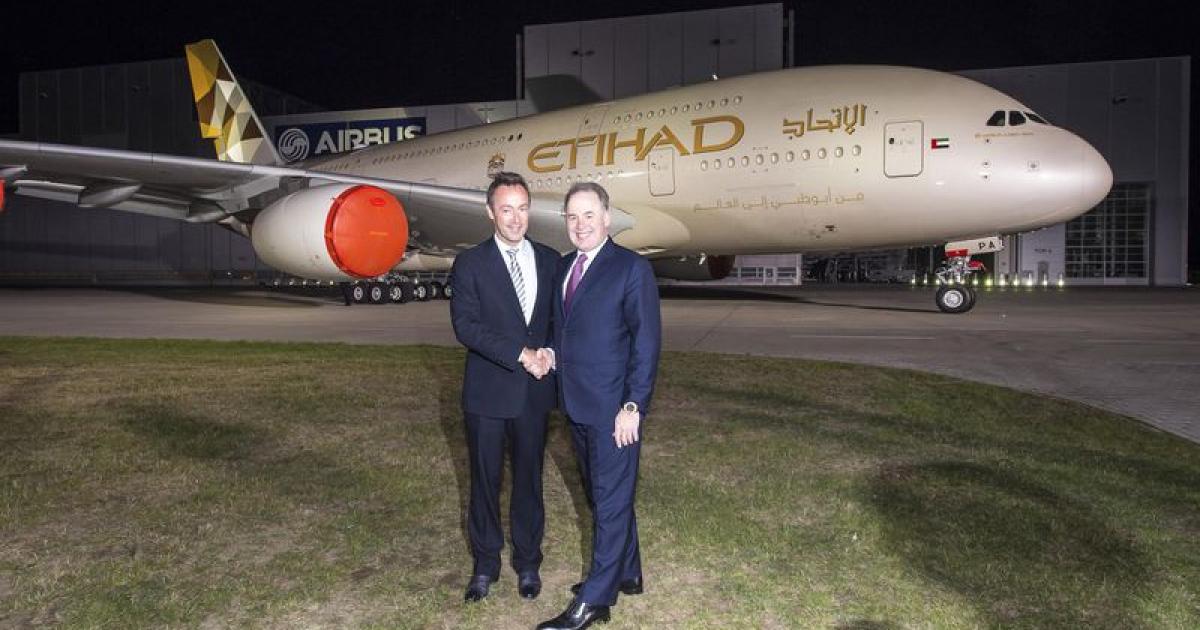 Airbus CEO Fabrice Bregier (left) and Etihad boss James Hogan help commemorate the unveiling of a new livery for the airline’s A380s in Hamburg. (Photo: Airbus)  
