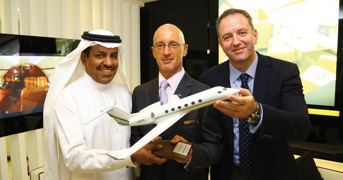 NasJet CEO Saad Saleh Alazwari, left, celebrates the first anniversary of a joint-venture FBO with ExecuJet (Middle East) managing director Mike Berry, center, and executive director Hadi Mouawad. The NasJet CEO said, “...there is significant growth potential for private aviation in countries like Egypt and Iraq.”