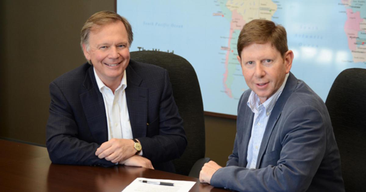  Jay Monroe, Globalstar chairman and CEO (l), and Avidyne president and CEO Dan Schwinn sign a partnership agreement to provide high-performance airborne connectivity at lower prices.