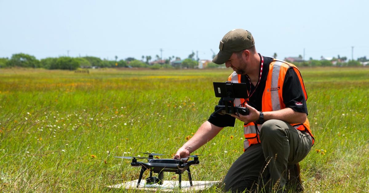 A researcher with Lone Star Unmanned Aircraft Systems Center readies a quadcopter for demonstration. (Photo: Lone Star UAS Center)