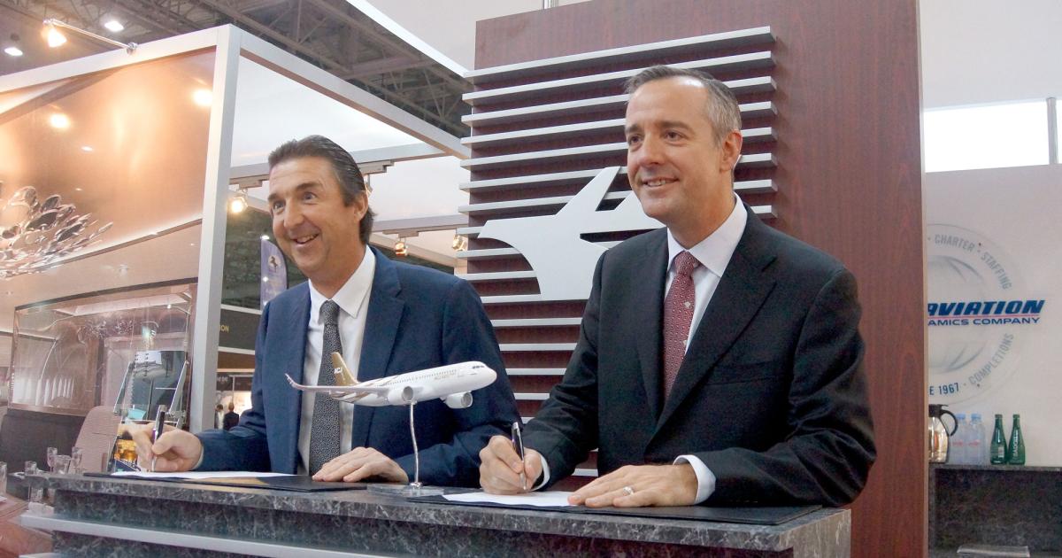 Airbus Corporate Jets managing director Benoit Defforge (left) and Robert Smith, president of Jet Aviation, are all smiles as Jet Aviation joins the ACJ service-center network.