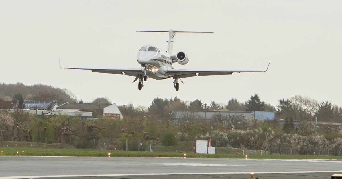 A NetJets Phenom 300 landing on Bremen Airport's Runway 27 after shooting the first SBAS approach in Germany flown by a "passenger aircraft."