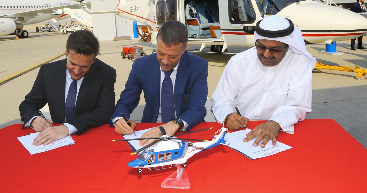 Falcon Aviation’s three-ship AW169 order at the 2017 Dubai Airshow is signed by (l to r) Milestone Aviation vice president commercial Michael York; Gian Piero Cutillo, managing director, Leonardo Helicopters; and Mahmood Hussain, managing director of Falcon Aviation. The AW169 seats up to 10 passengers and is single-pilot capable.